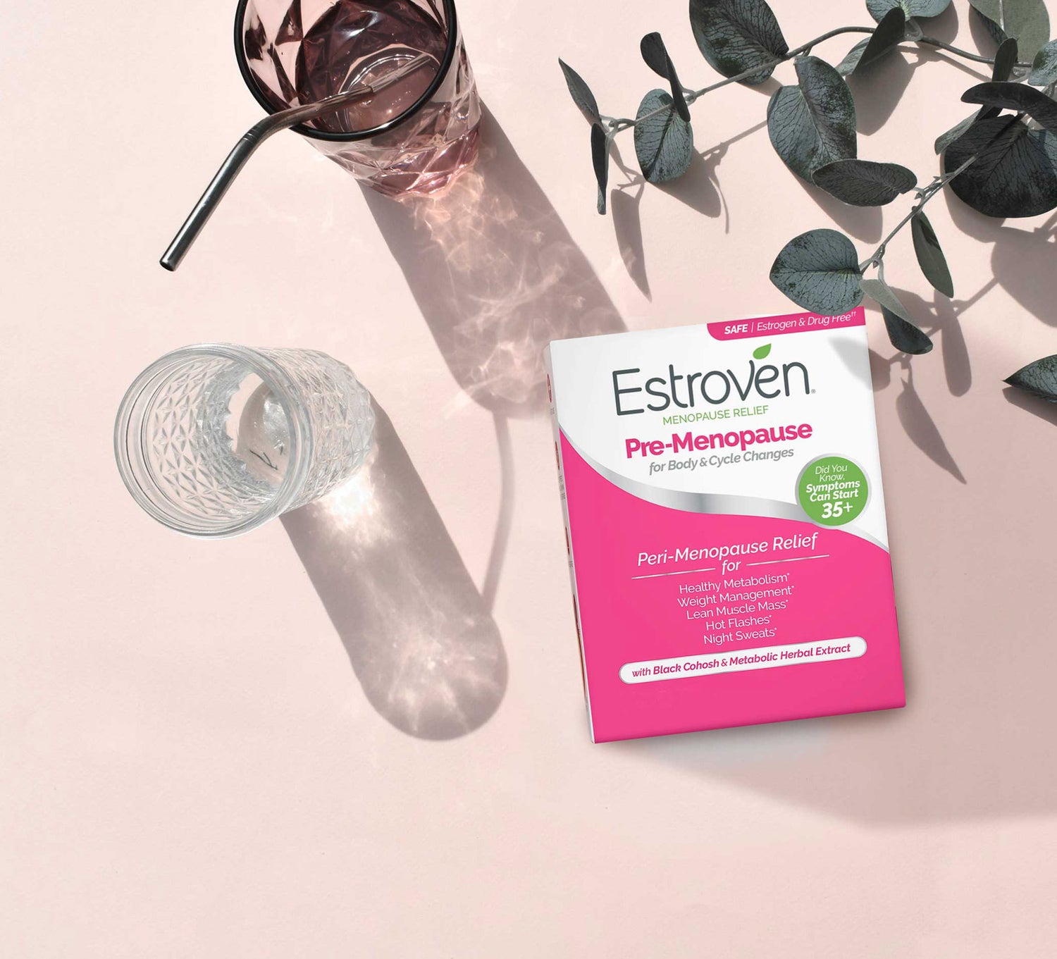 image of pre-menopause product next to glass of water and ivy plant