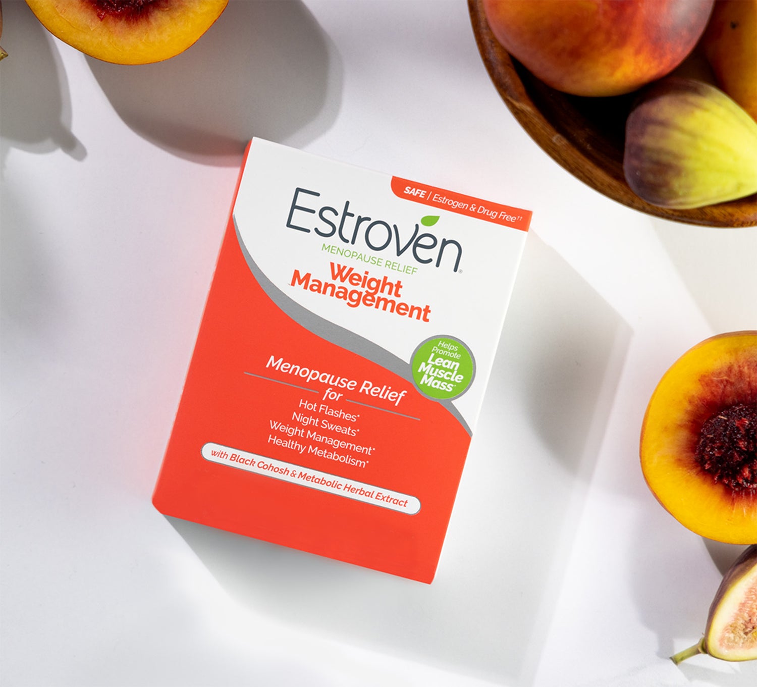 Estroven Weight Management product top view box on table surrounded by peaches